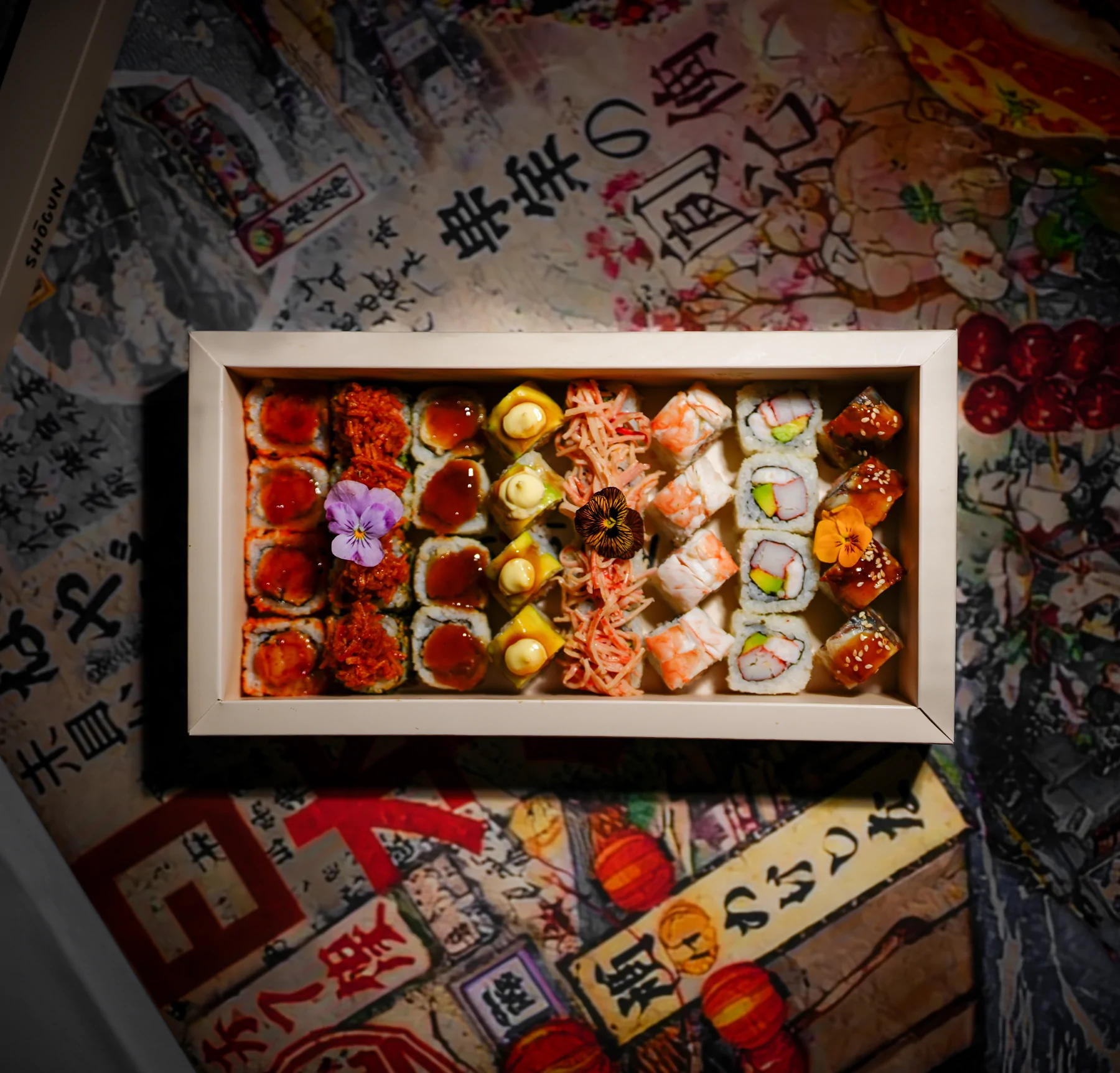 A Shōgun sushi box presented on a patterned table